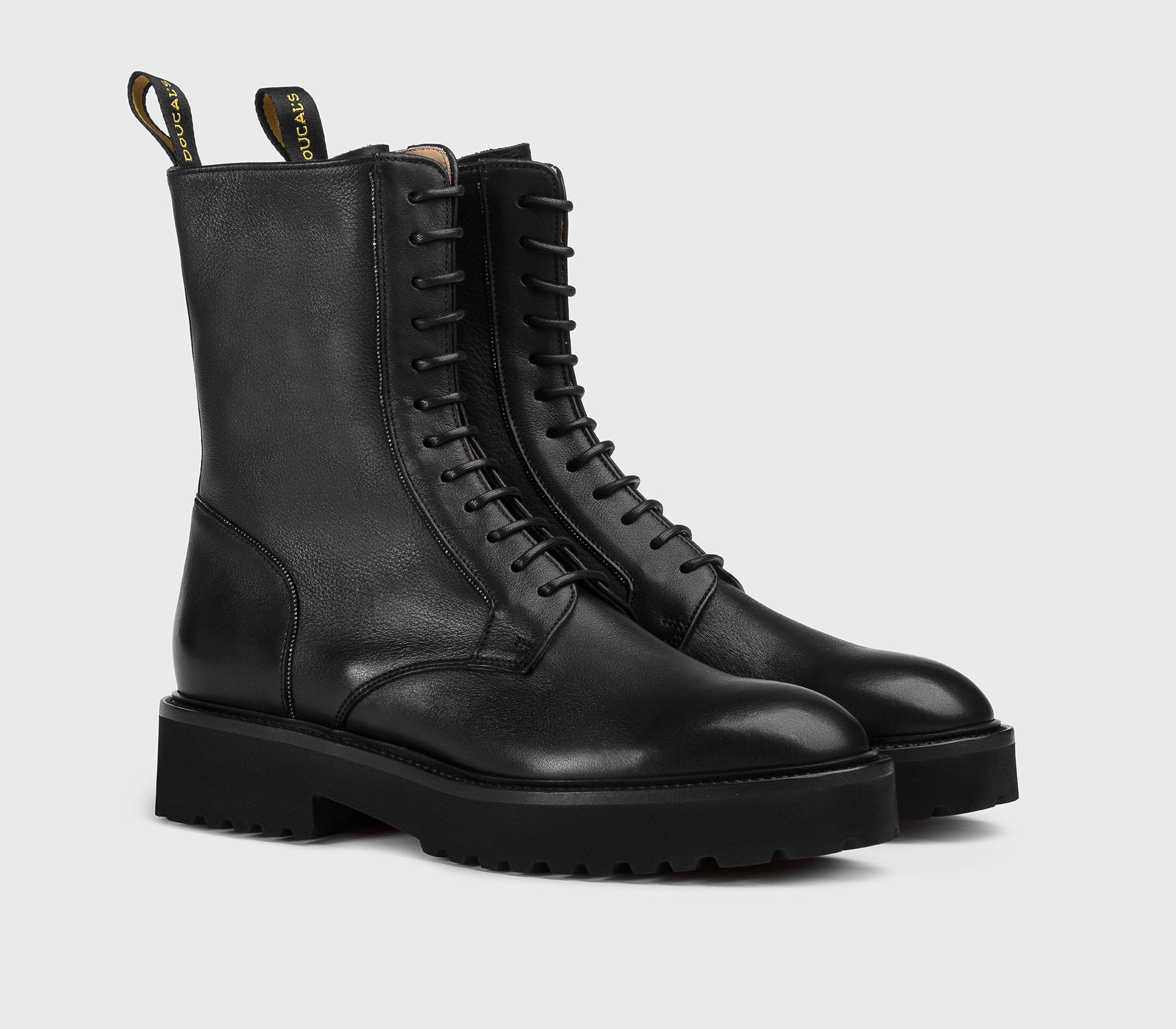 Black leather combat boot with metal detail