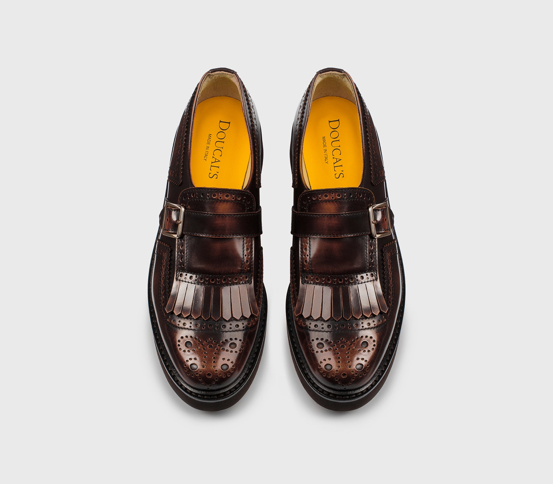 Tan-coloured leather single-buckle shoe with fringing