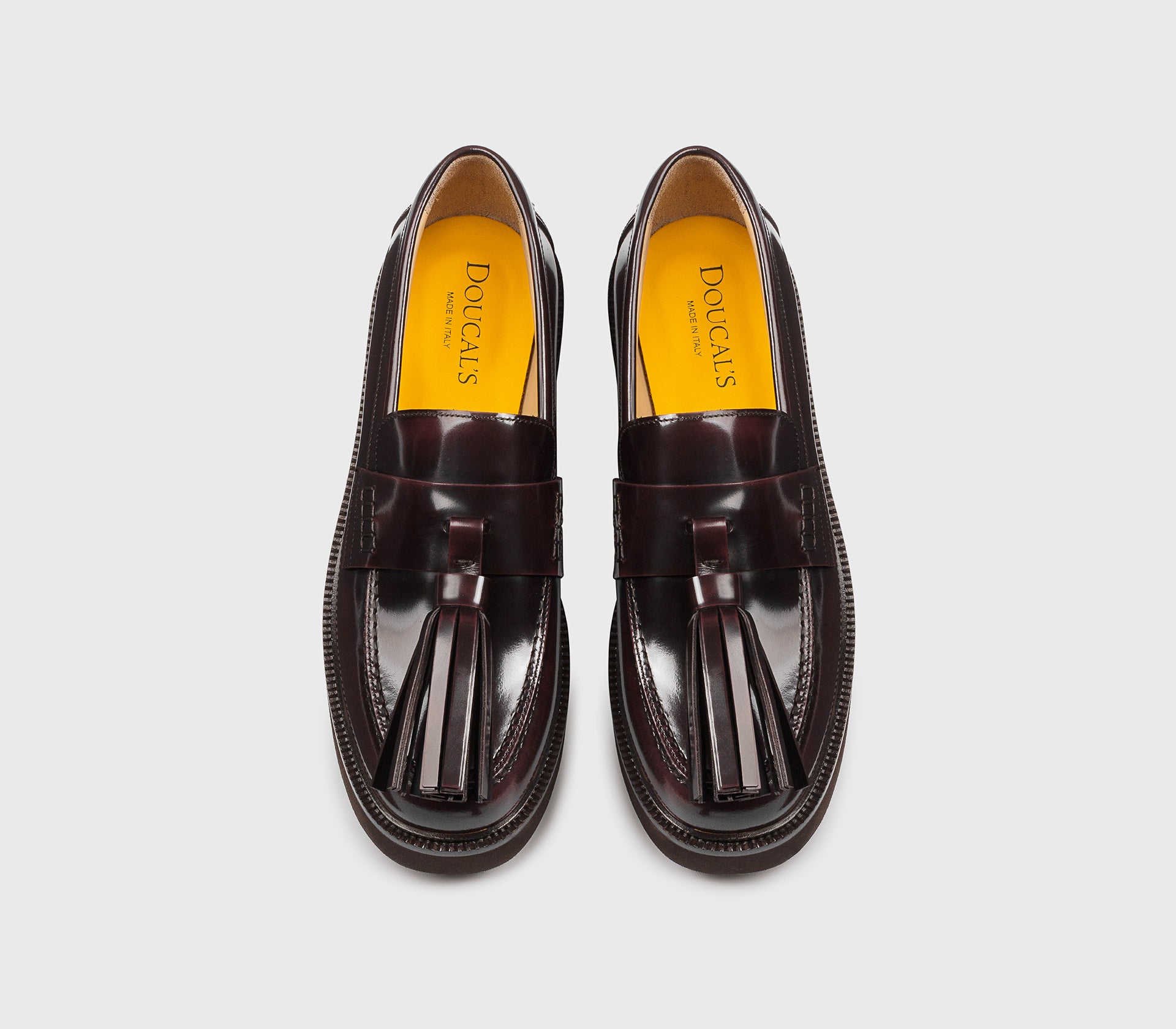 Mocassin avec maxi pompon en cuir bordeaux