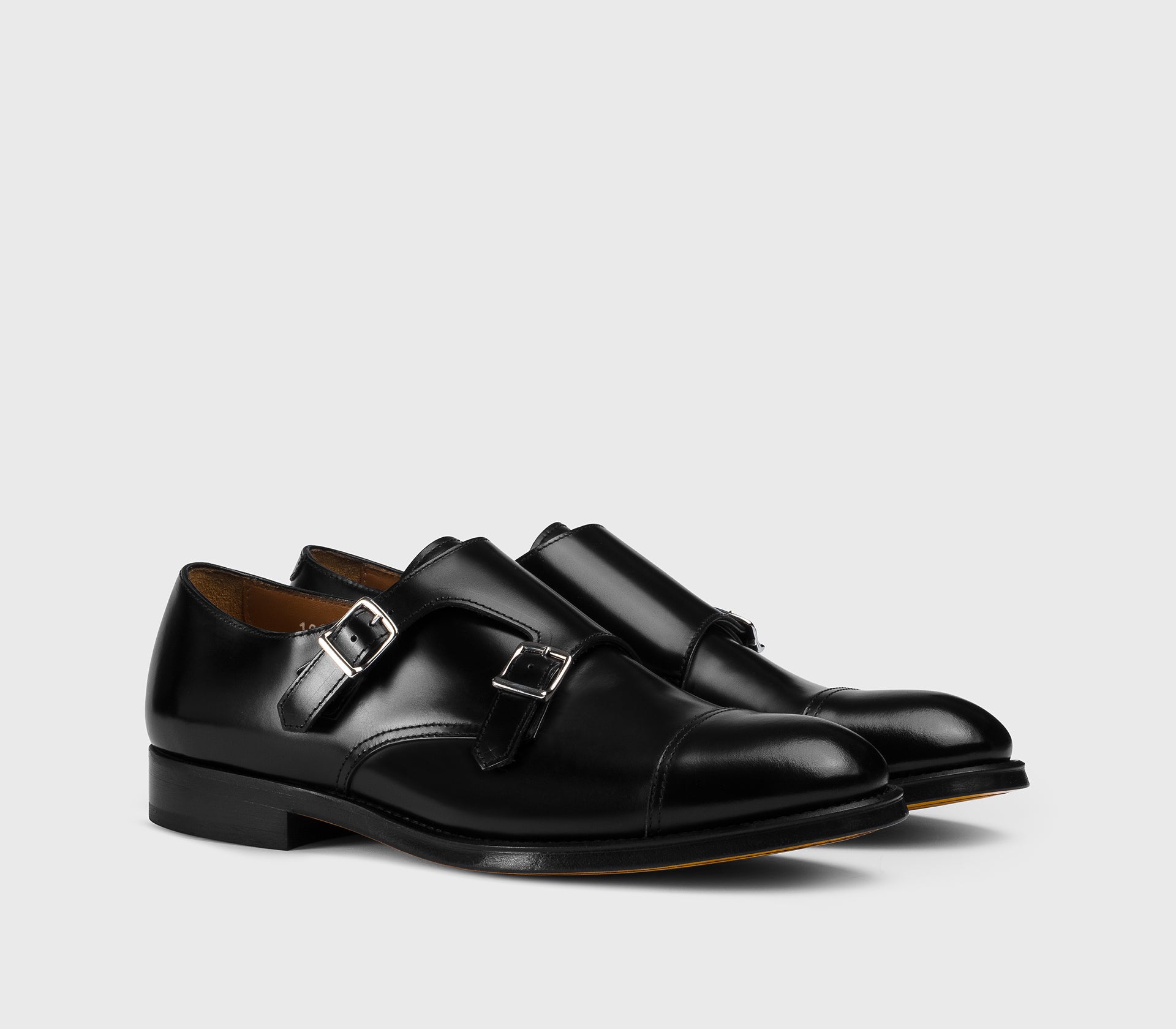 Black leather double-buckle shoe