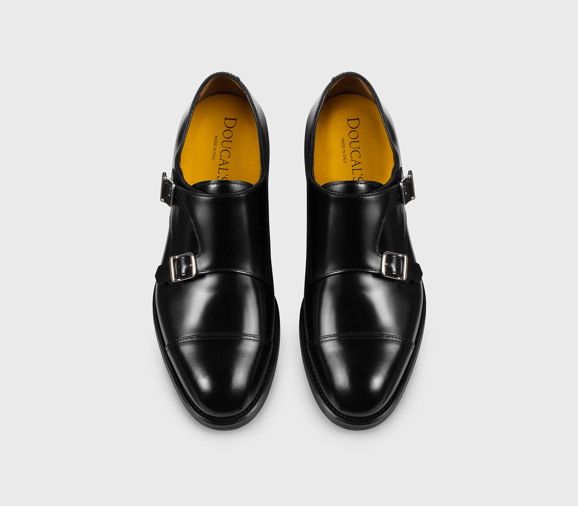 Black leather double-buckle shoe
