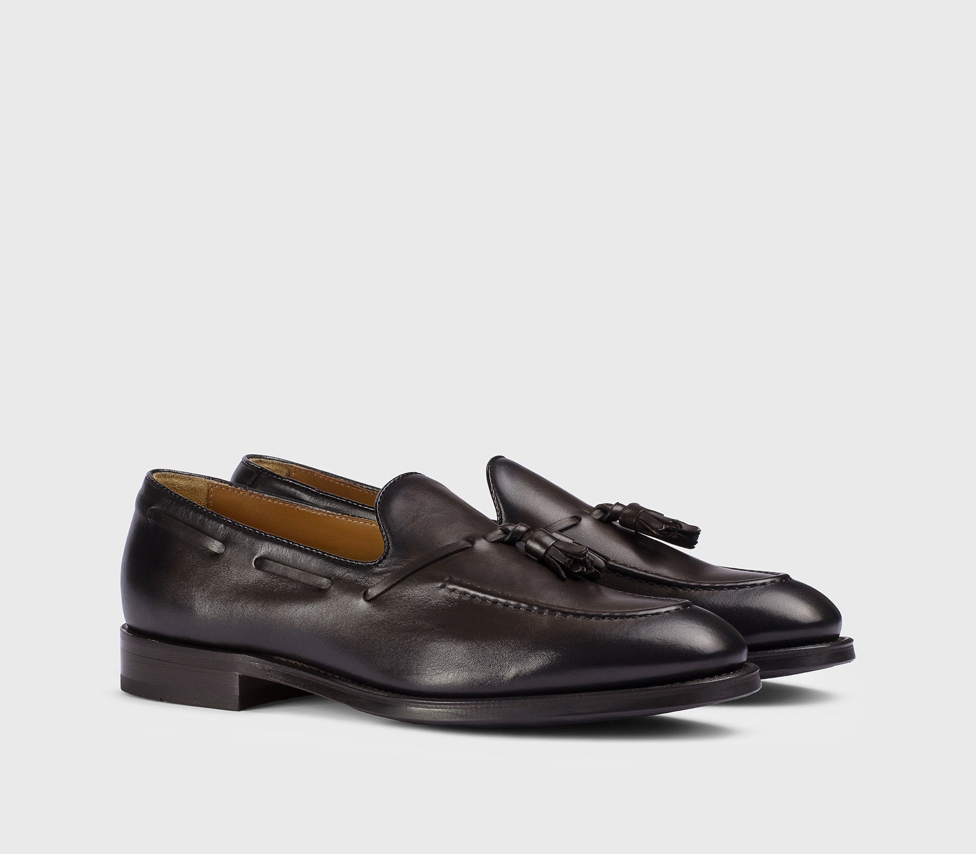 Dark brown leather loafer with tassels