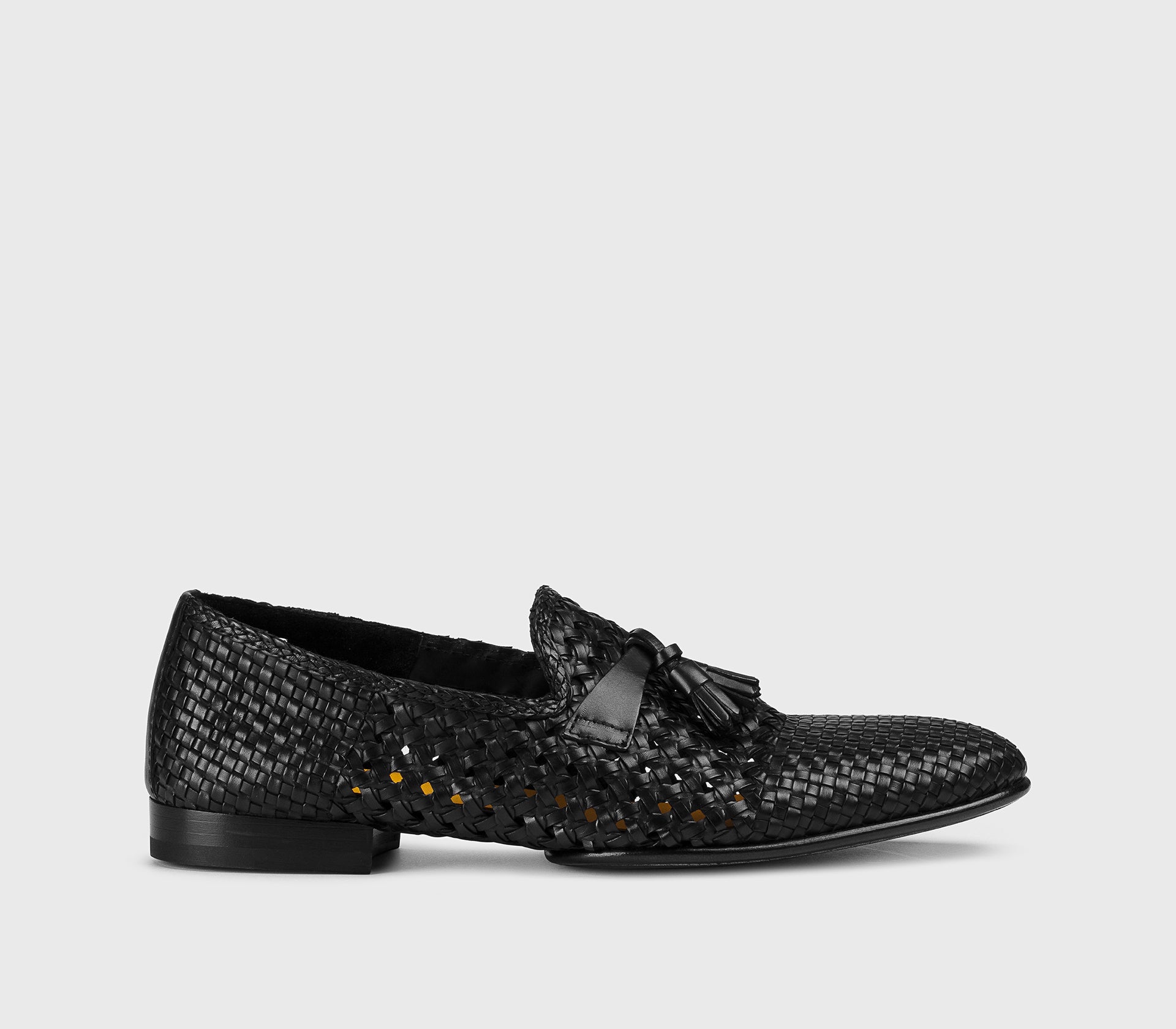 Black leather openwork loafer with tassels