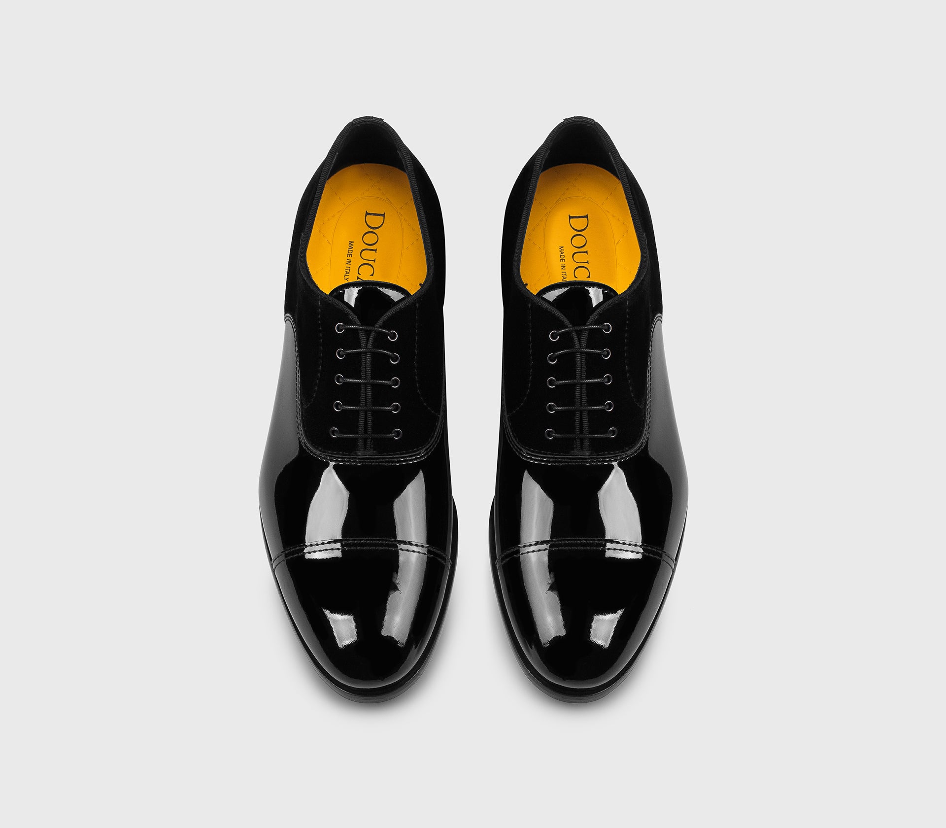 Black patent leather and velvet lace-up