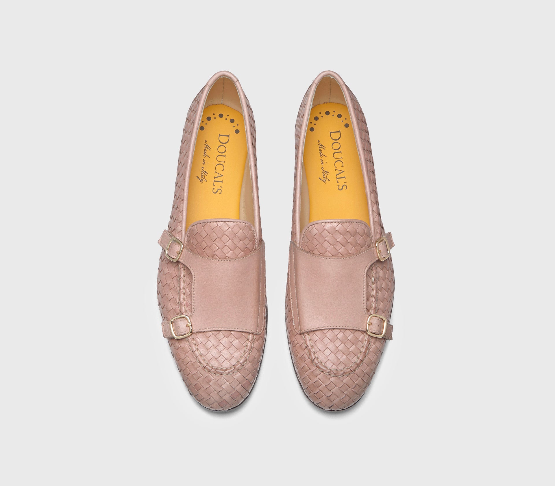 Double-buckle loafers in pink woven leather