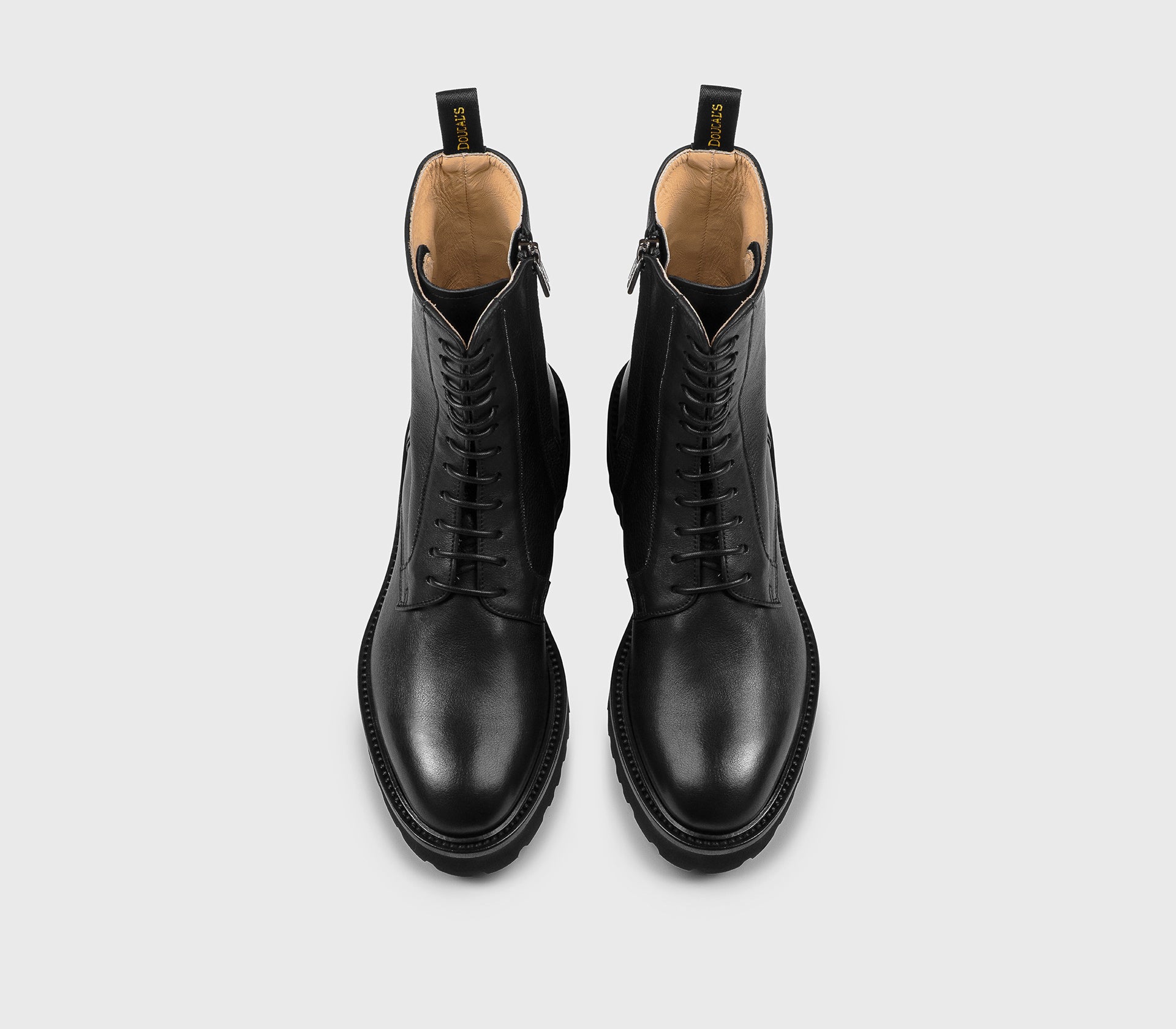 Black leather combat boot with metal detail