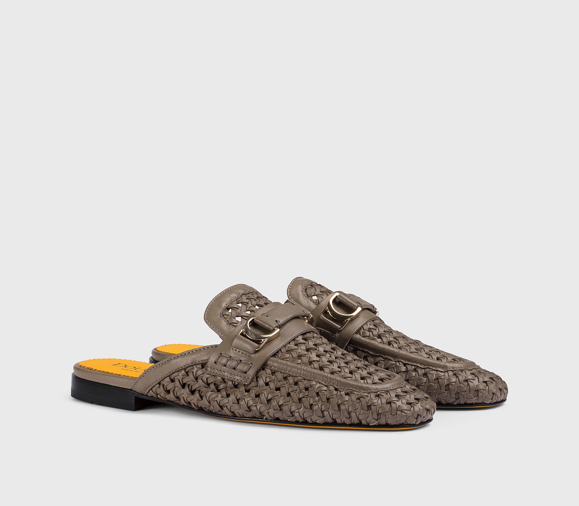 Mud-colored leather openwork mule with metal accessory