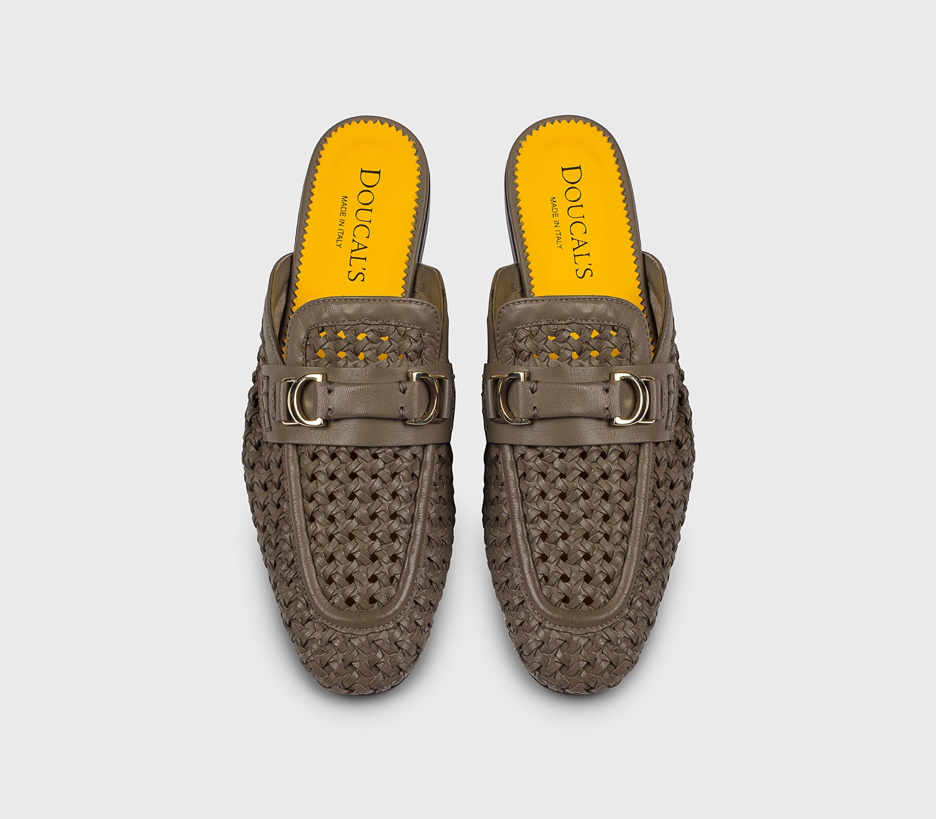 Mud-colored leather openwork mule with metal accessory