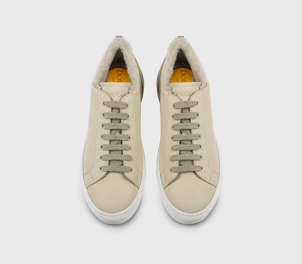 Sneaker en cuir blanc « craie » avec détail fourrure