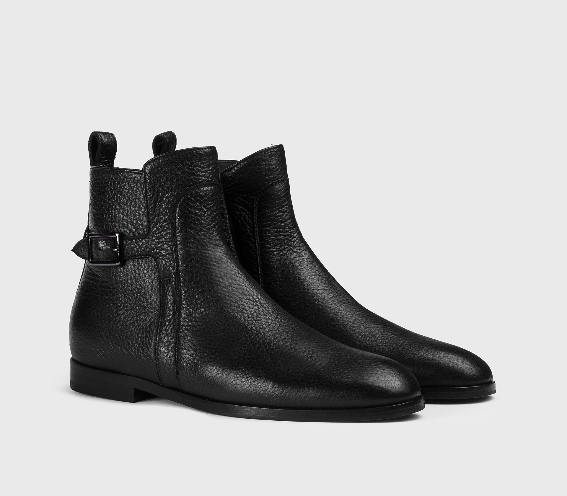 Black leather ankle boot with strap