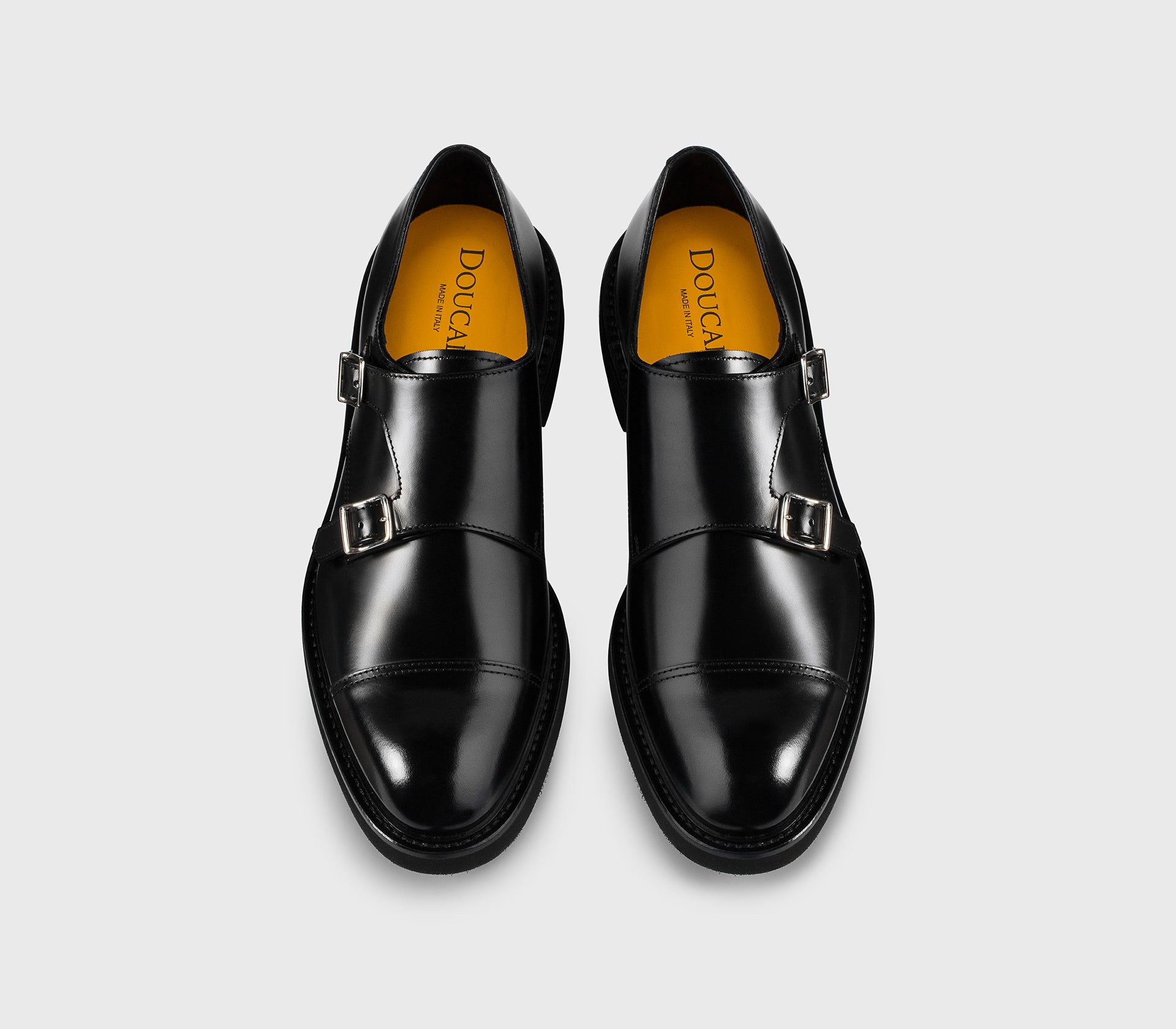 Black leather double-buckle shoe.