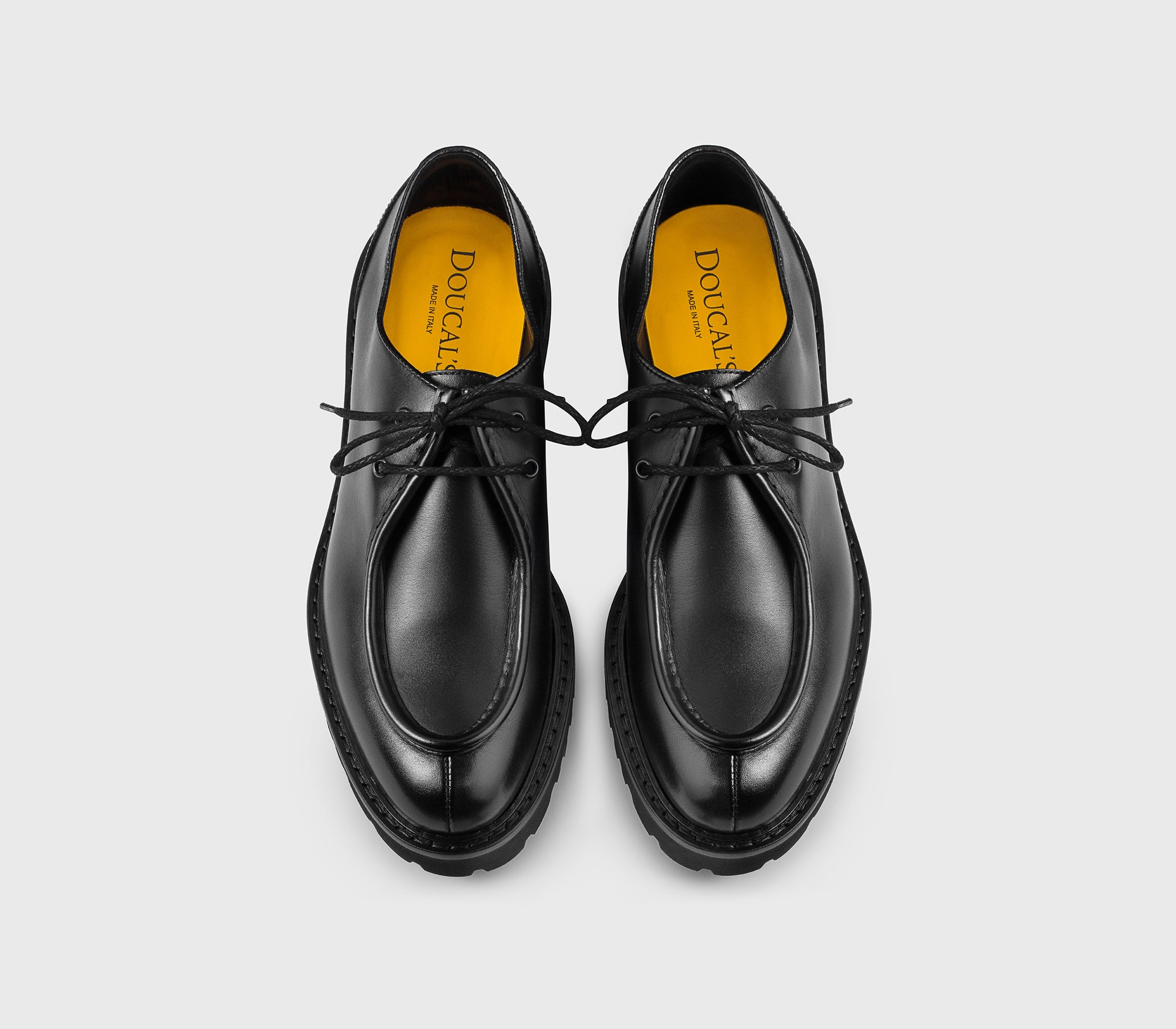 Black two-hole leather lace-up.