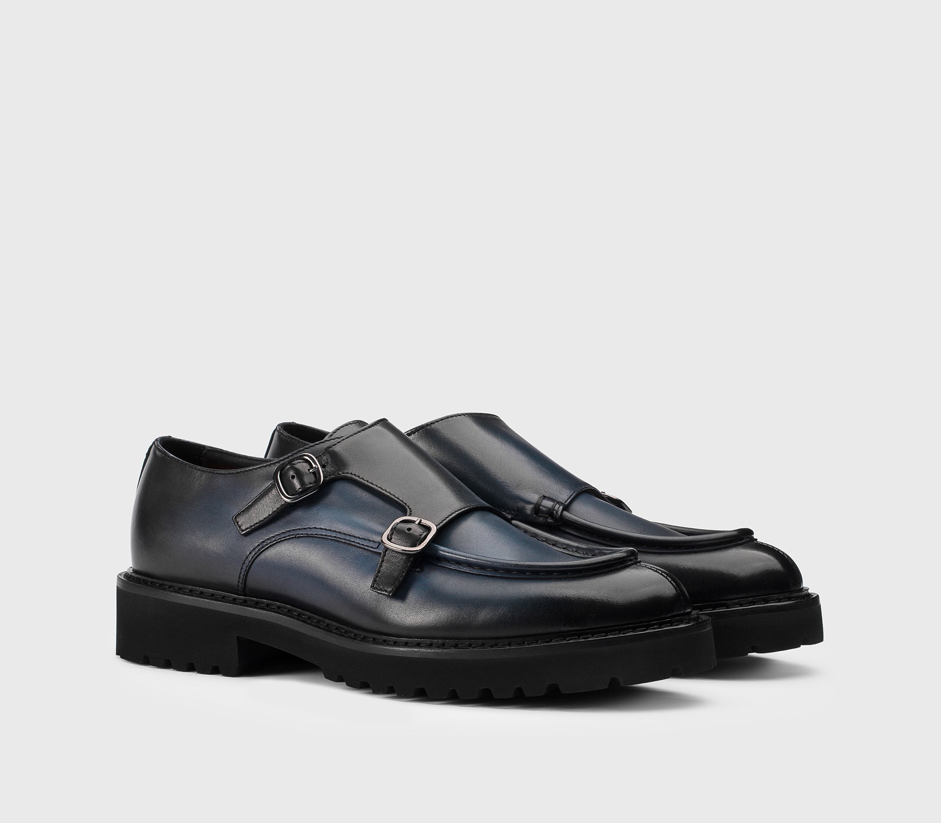 Blue leather double-buckle shoe.