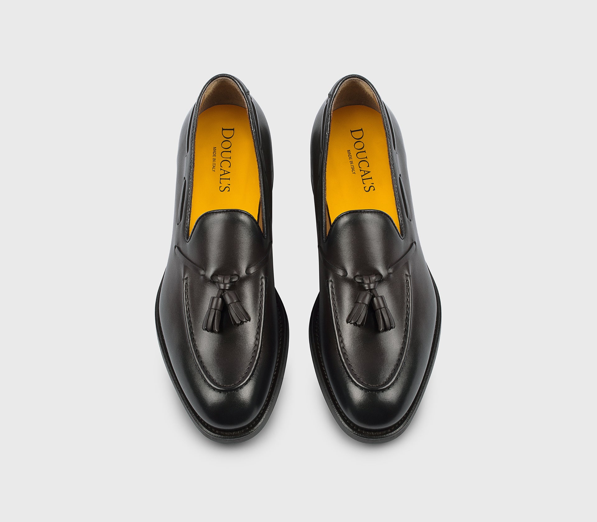 Dark brown leather loafer with tassels