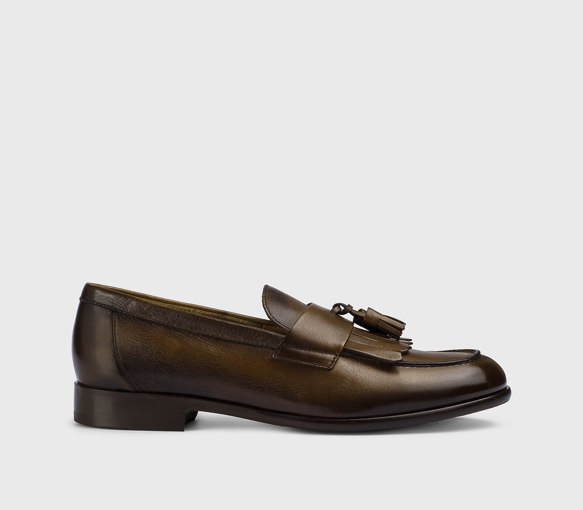 Brown leather loafer with tassels and fringe